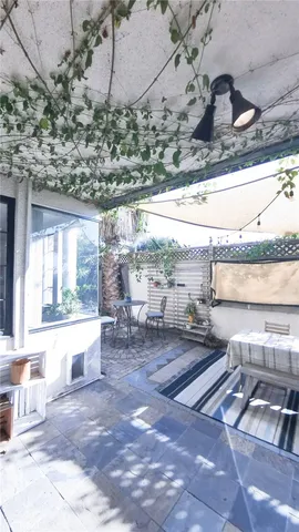 a view of a house with outdoor space and sitting area