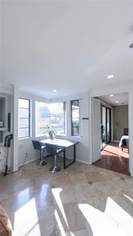 a living room with furniture and kitchen view