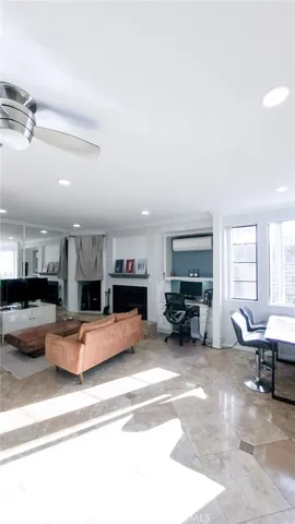 a bedroom with a large bed and a large window