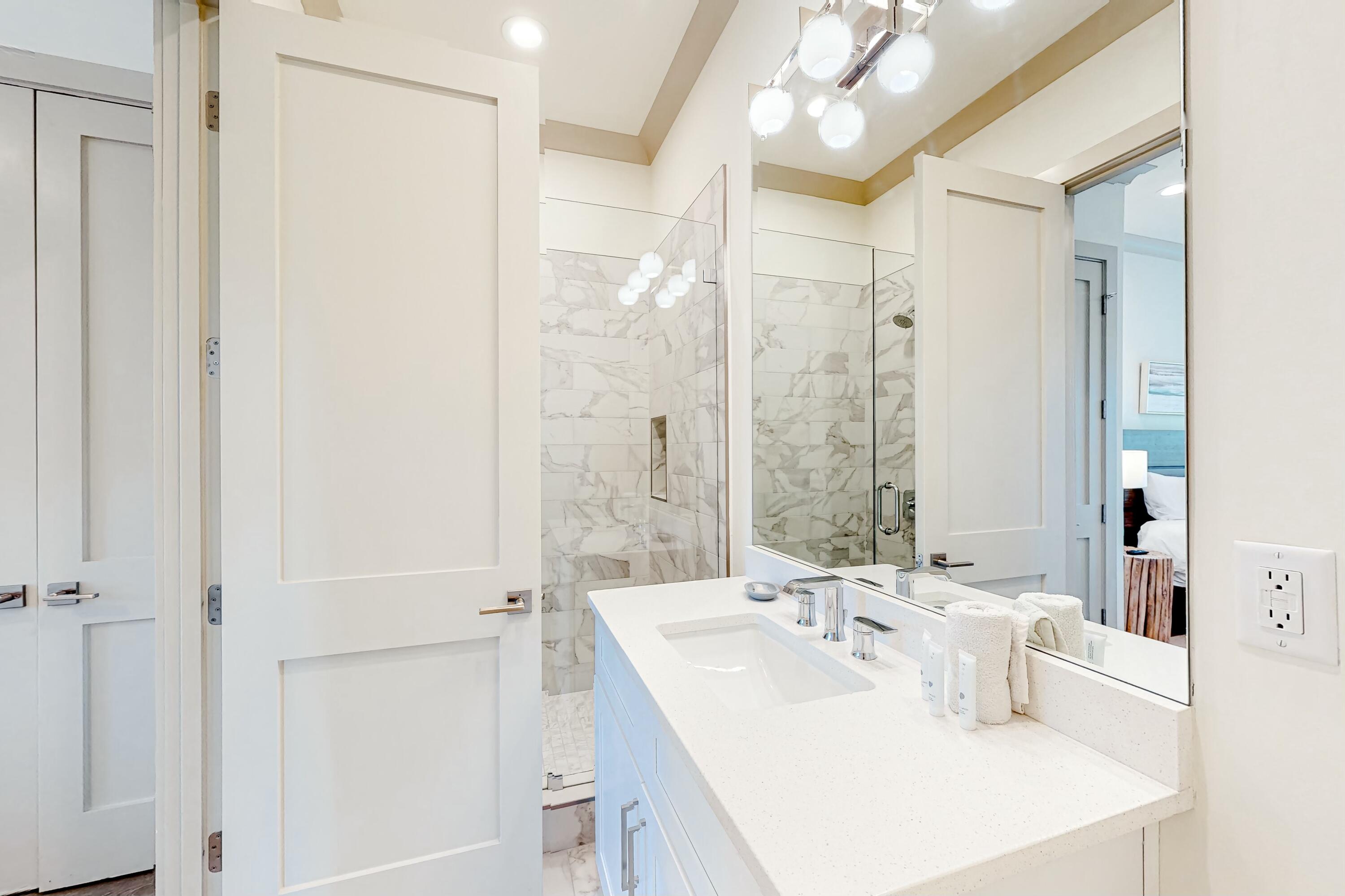 70 Marthas Lane, Unit 2201 Santa Rosa Beach, FL 32459 - Photo 13 of 28 a bathroom with a sink and a mirror