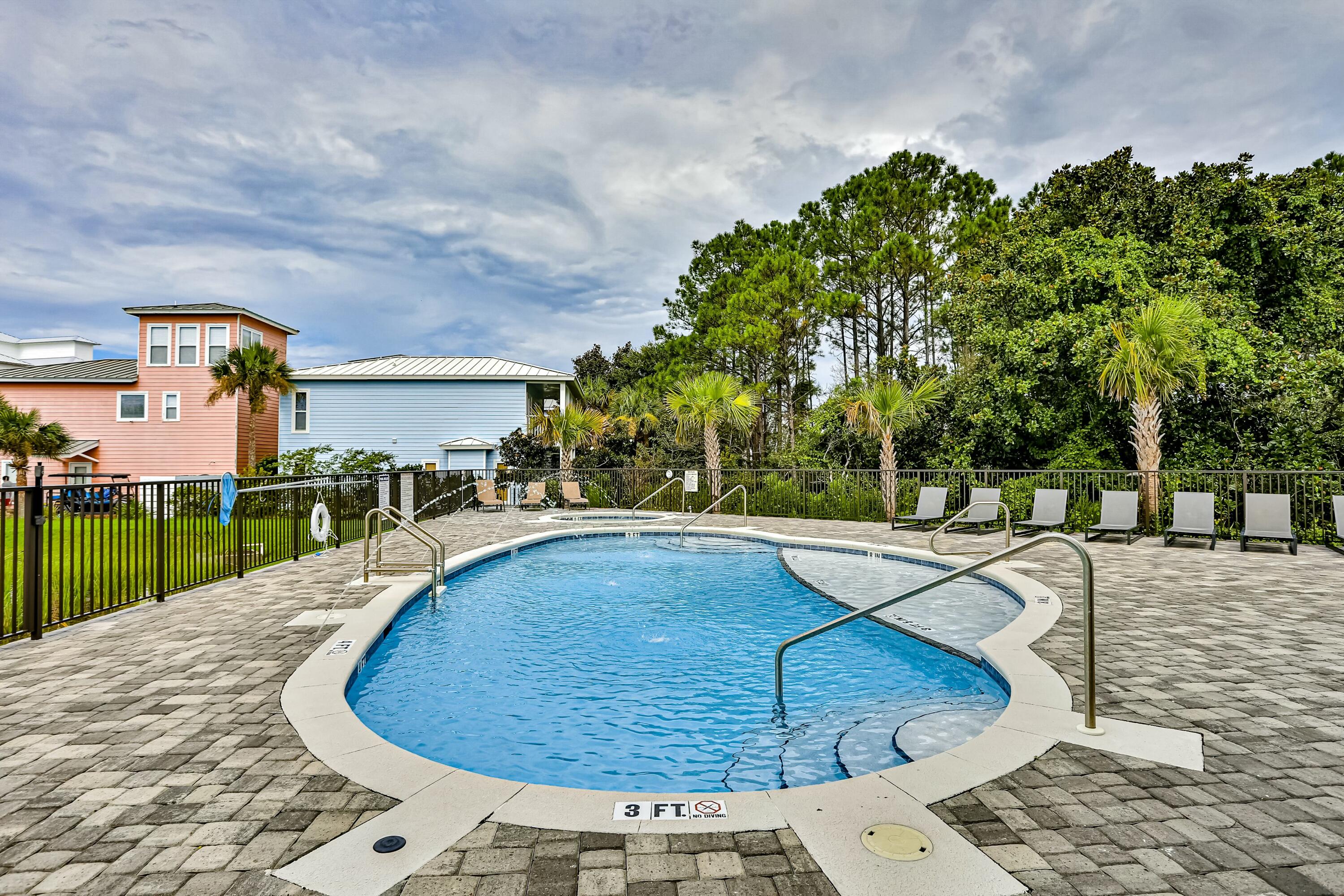 70 Marthas Lane, Unit 2201 Santa Rosa Beach, FL 32459 - Photo 17 of 28 a view of a swimming pool with a yard