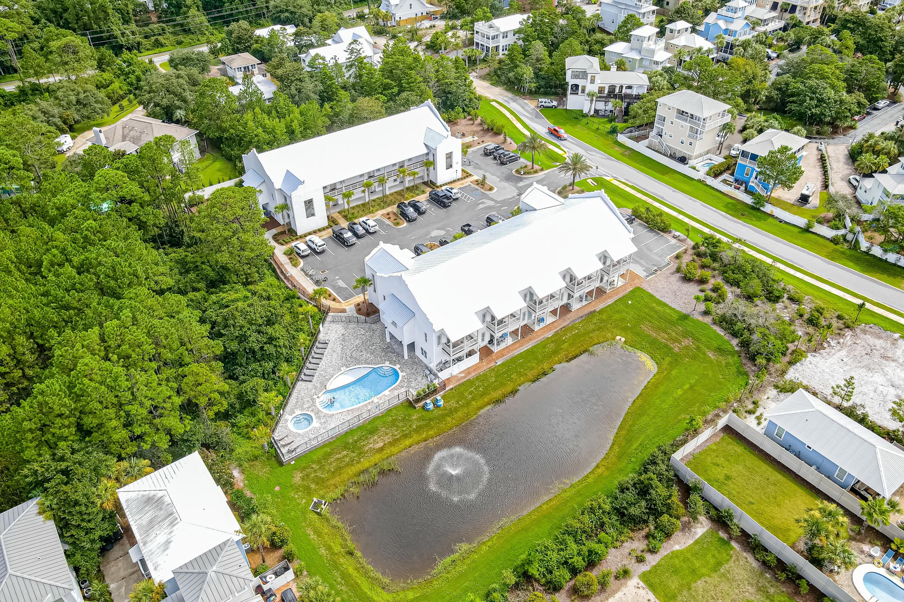 70 Marthas Lane, Unit 2201 Santa Rosa Beach, FL 32459 - Photo 19 of 28 an aerial view of a house with a yard and lake view