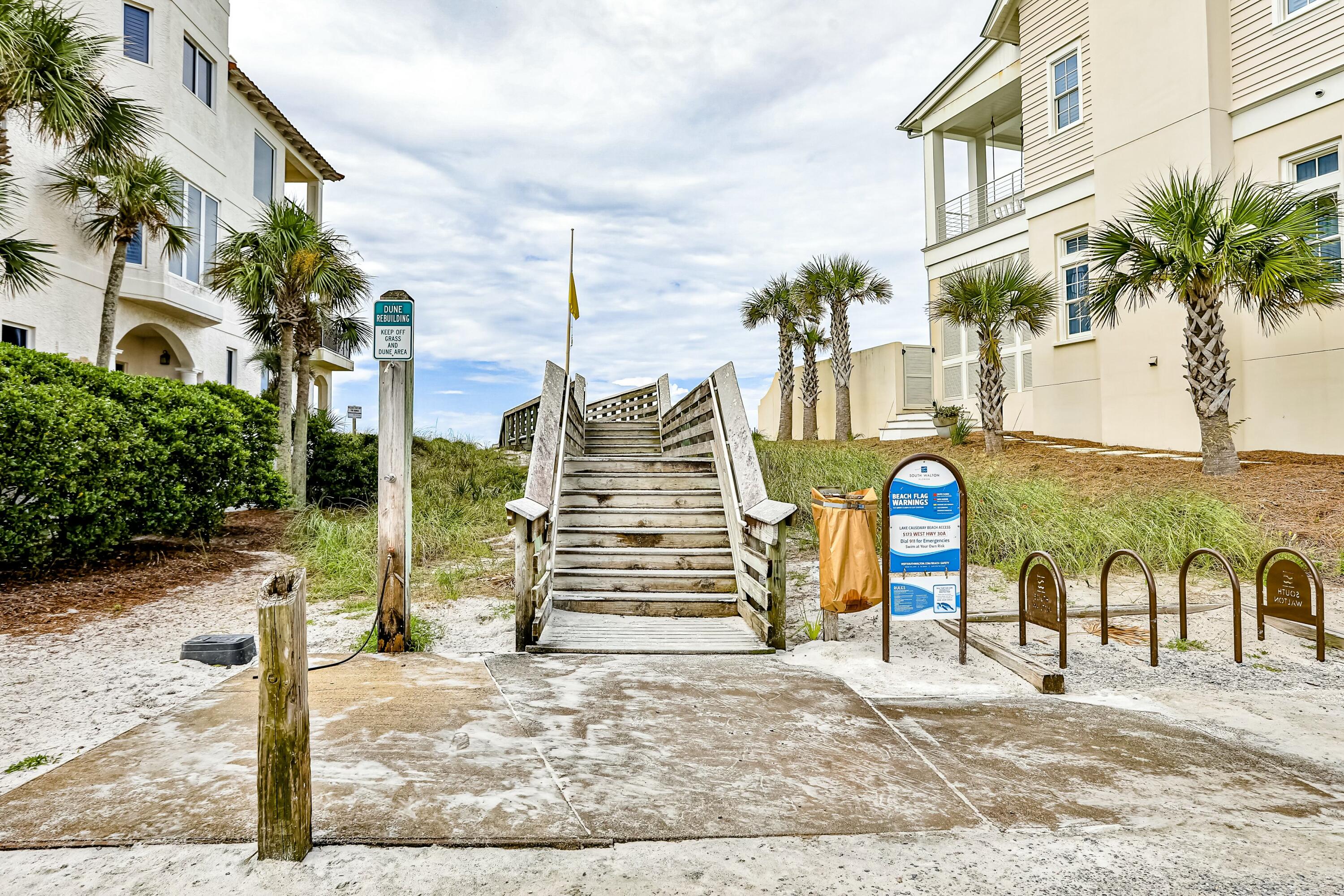 70 Marthas Lane, Unit 2201 Santa Rosa Beach, FL 32459 - Photo 24 of 28 a view of a multi story residential apartment building with a yard and garage