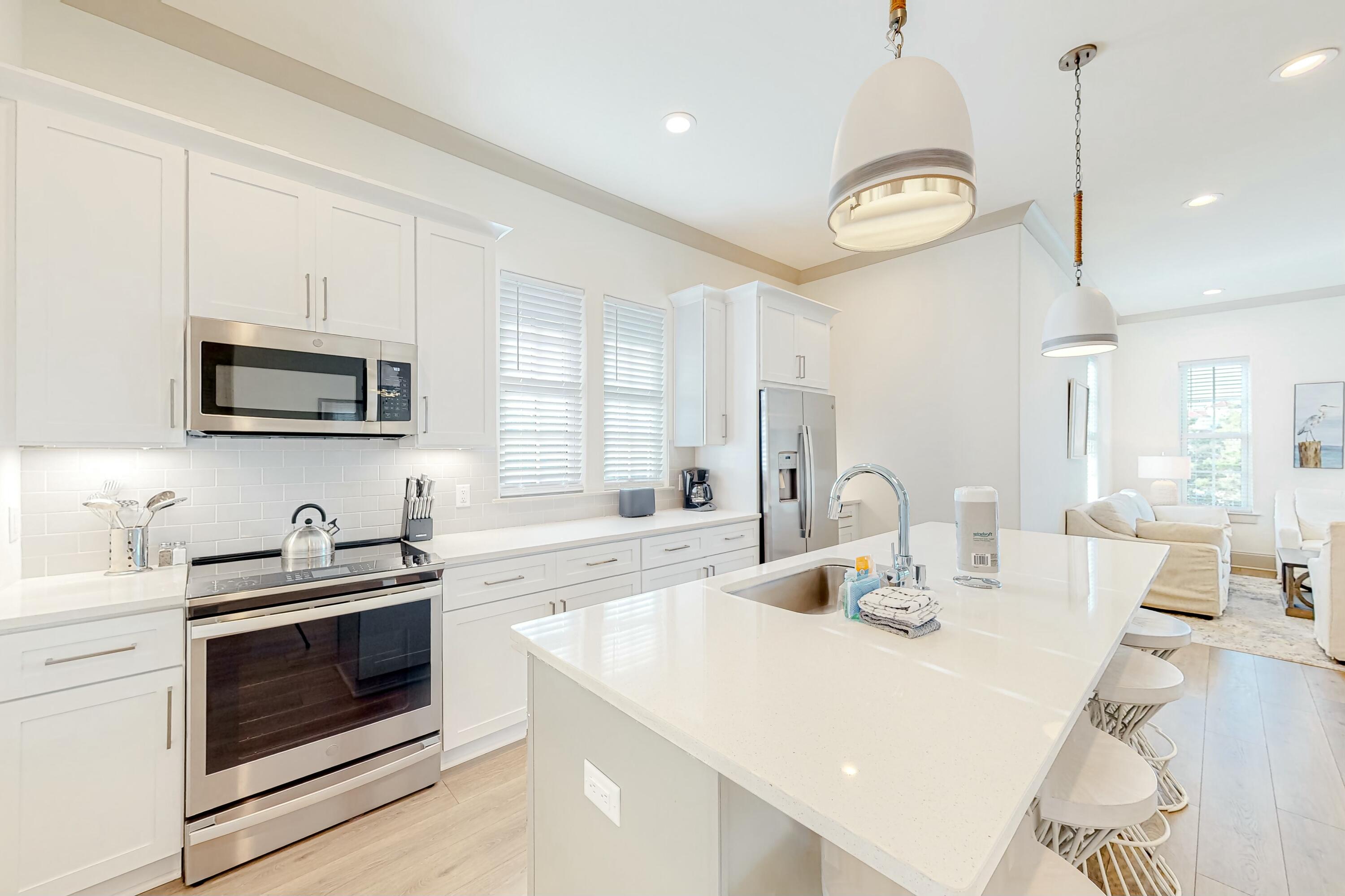 70 Marthas Lane, Unit 2201 Santa Rosa Beach, FL 32459 - Photo 6 of 28 a kitchen with a stove a sink and a microwave