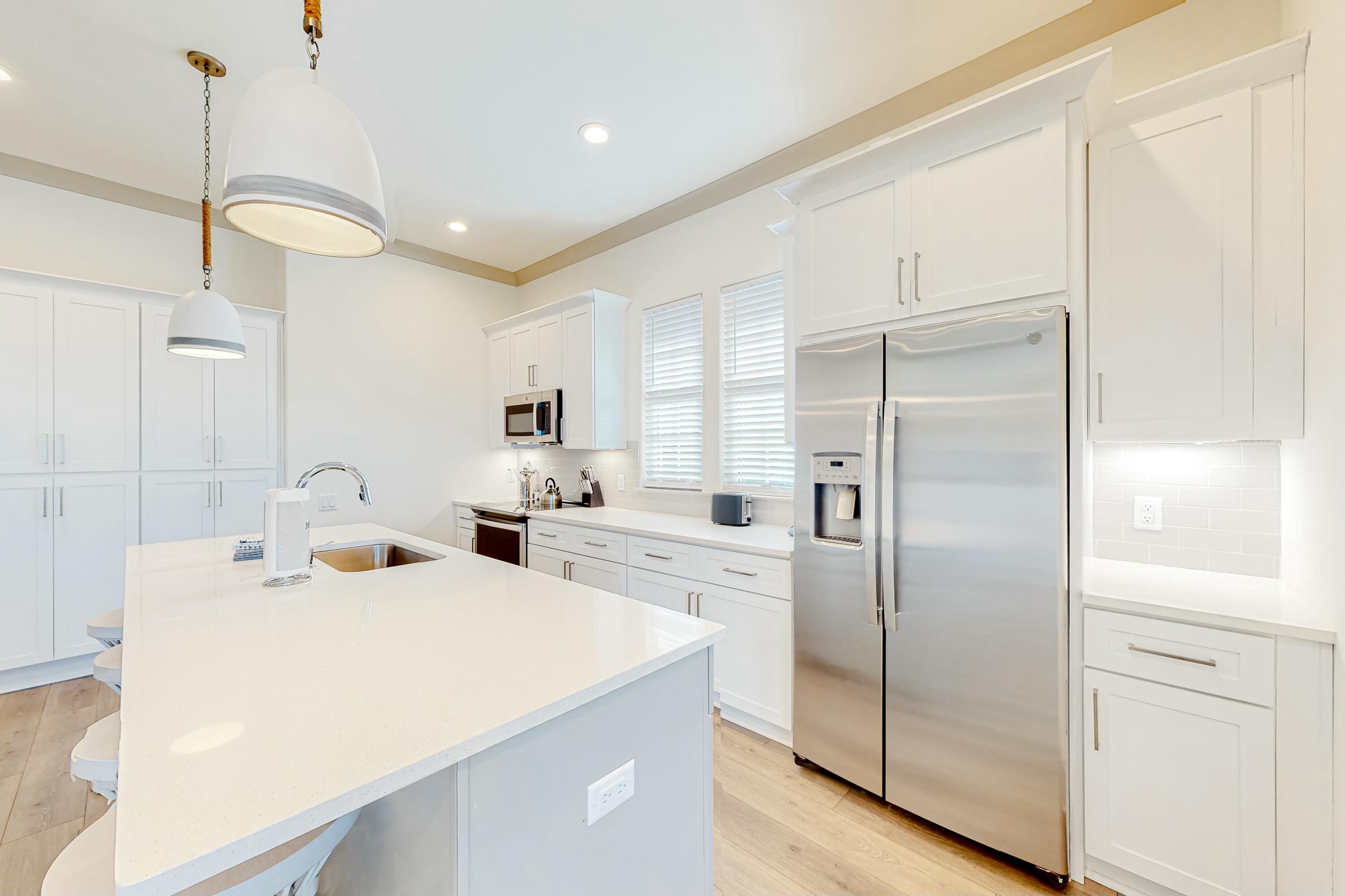 70 Marthas Lane, Unit 2201 Santa Rosa Beach, FL 32459 - Photo 8 of 28 a kitchen with stainless steel appliances a refrigerator sink and cabinets