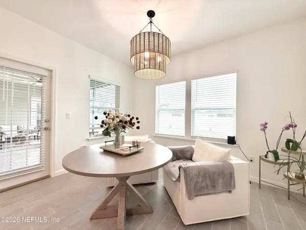 a view of a dining room with furniture window and outside view