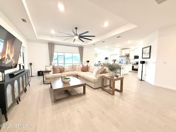 a living room with furniture and a large window