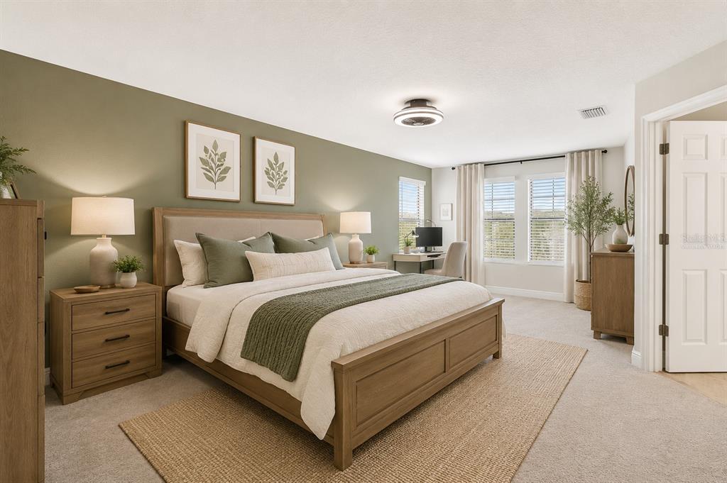 4300 Burdick Loop Odessa, FL 33556 - Photo 15 of 41 a spacious bedroom with a bed and a lamp