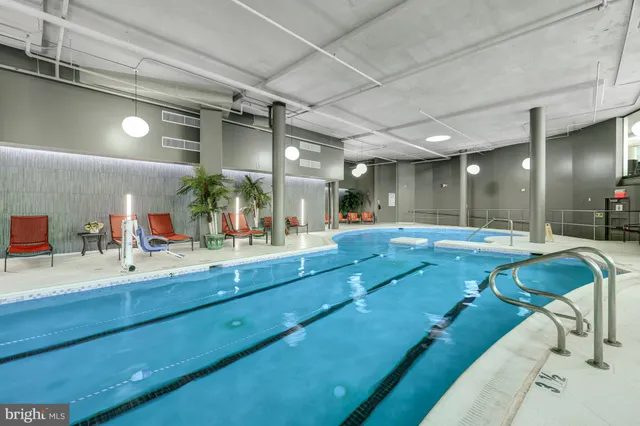 a bathroom with a large tub sink and shower