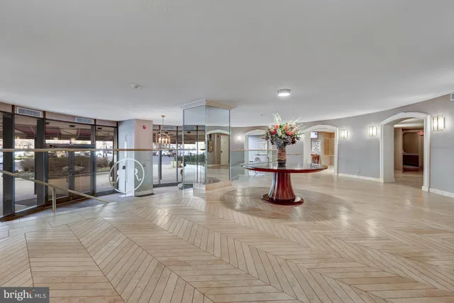 a view of a hall way with furniture