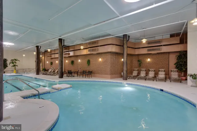 a view of a patio with dining table and chairs