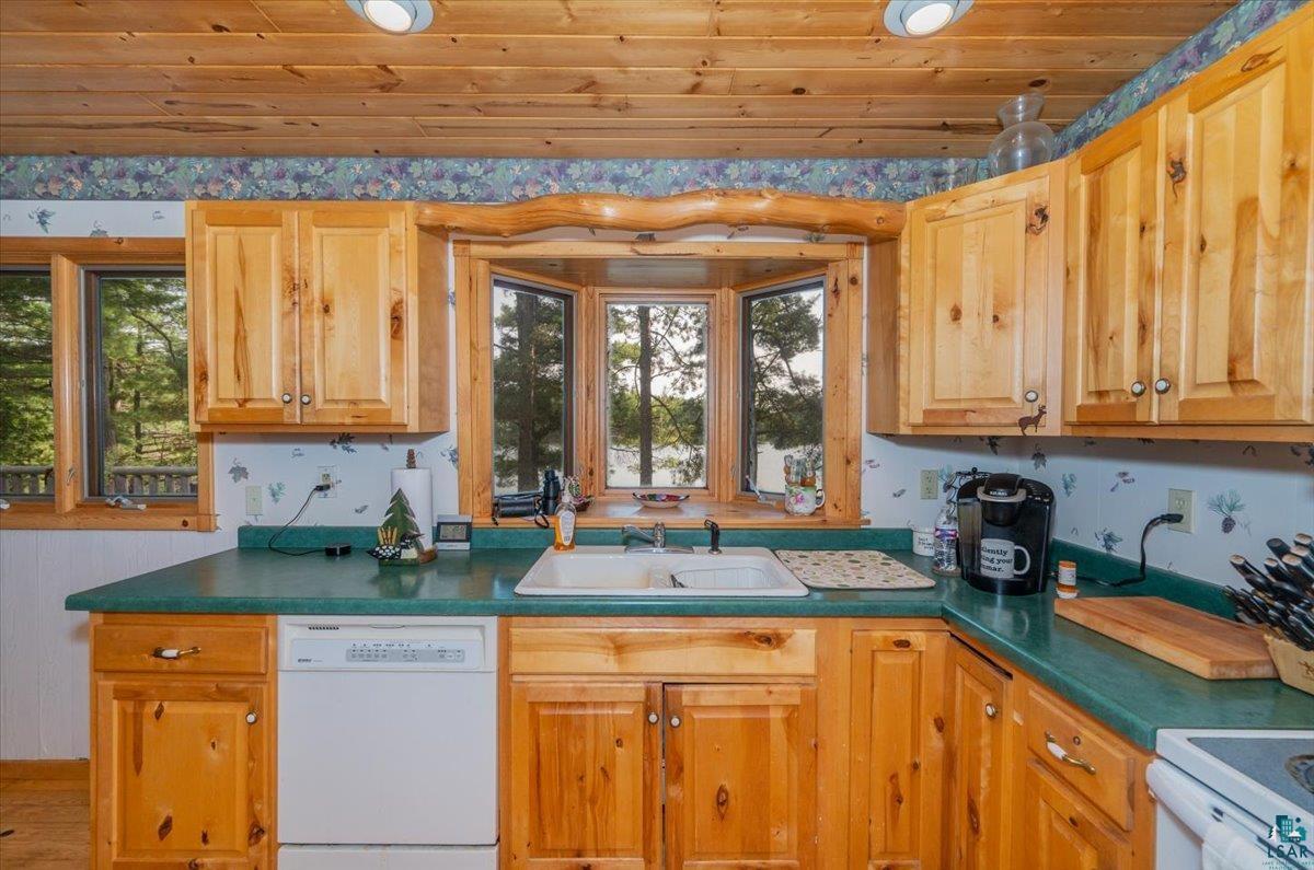 11758 South Long Lake Road Solon Springs, WI 54873 - Photo 11 of 38 Kitchen featuring wood ceiling, dishwasher, sink, and plenty of natural light