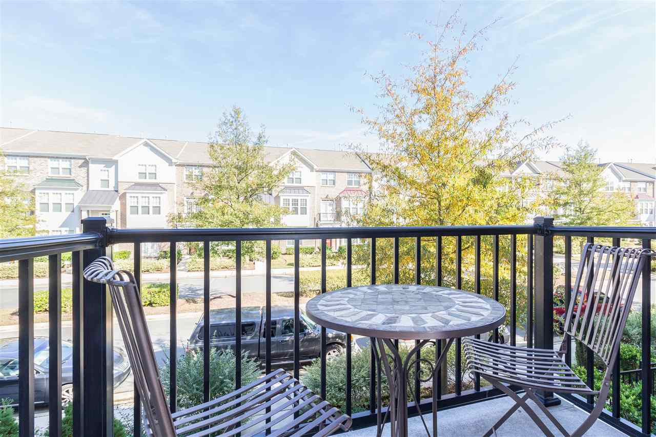 9135 Falkwood Road Raleigh, NC 27617 - Photo 8 of 25 The Juliet balcony is off the family room and is the second of three outdoor spaces. A perfect spot to enjoy your morning coffee. Front Balcony