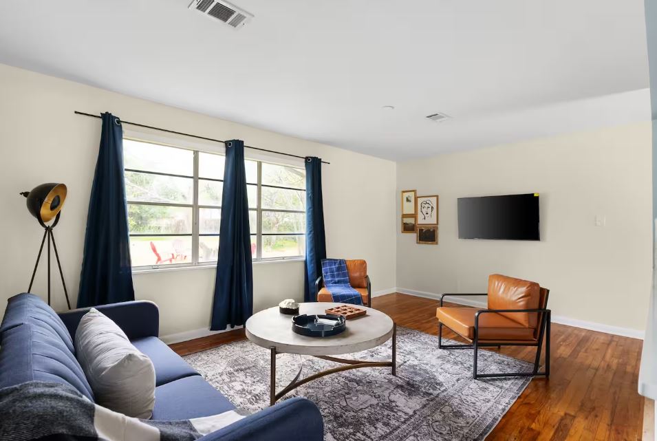 1100 Neans Drive Austin, TX 78758 - Photo 10 of 40 Living room featuring hardwood / wood-style flooring and baseboards