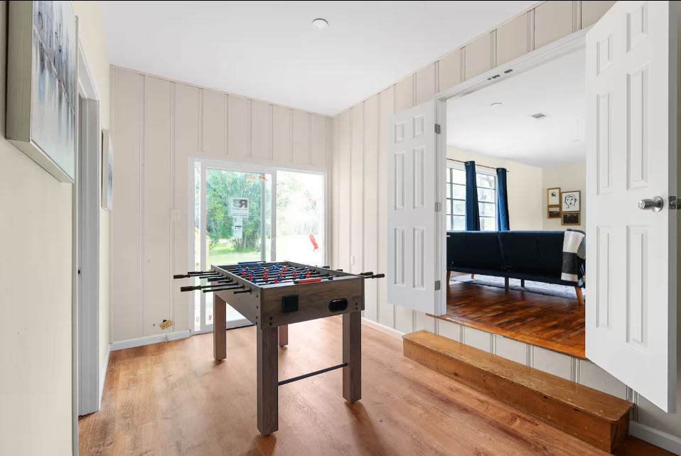 1100 Neans Drive Austin, TX 78758 - Photo 12 of 40 Rec room with light wood-style flooring and baseboards