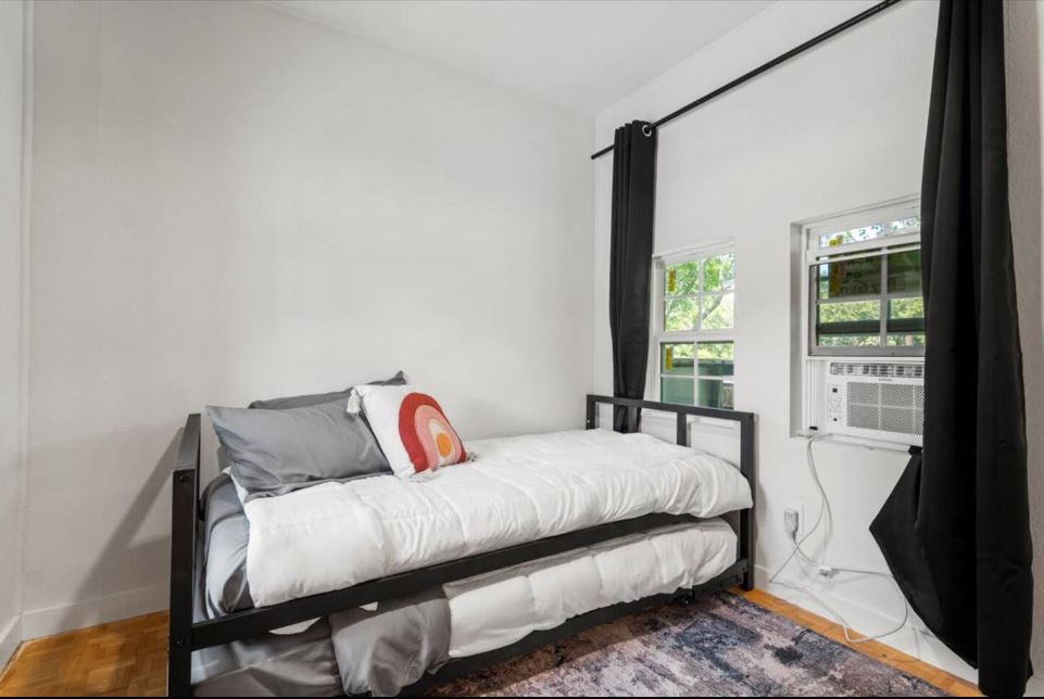 1100 Neans Drive Austin, TX 78758 - Photo 18 of 40 Bedroom with parquet floors and cooling unit