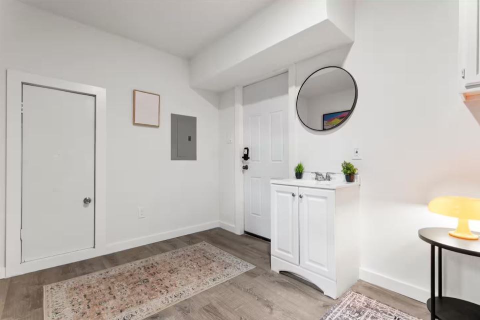 1100 Neans Drive Austin, TX 78758 - Photo 35 of 40 Entryway with electric panel and light wood finished floors