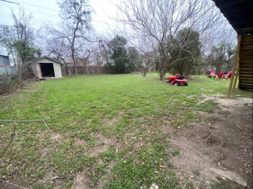 1100 Neans Drive Austin, TX 78758 - Photo 39 of 40 Fenced backyard featuring a storage shed
