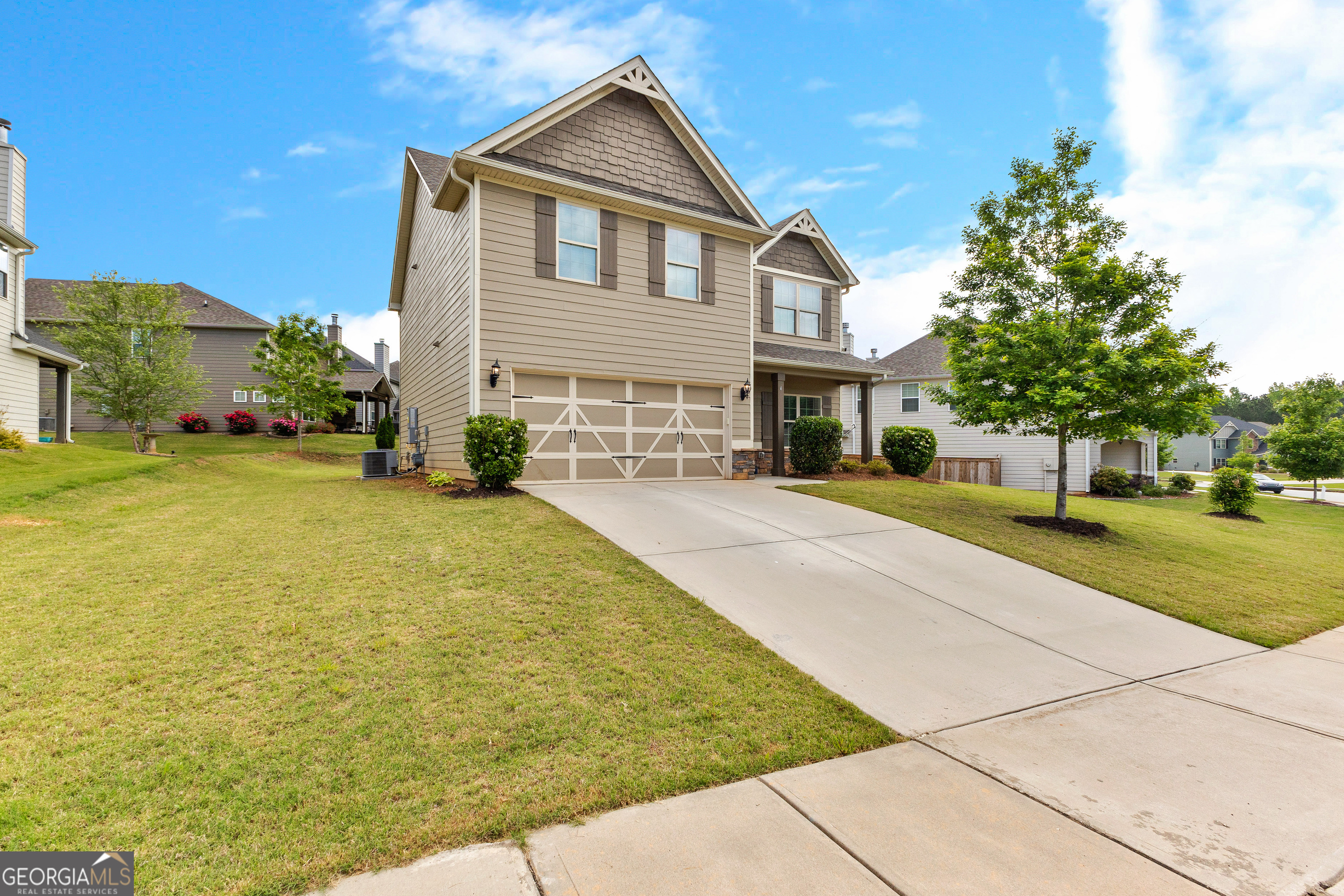 4 Collette Cove Newnan, GA 30265 - Photo 1 of 1 a front view of a house with a yard