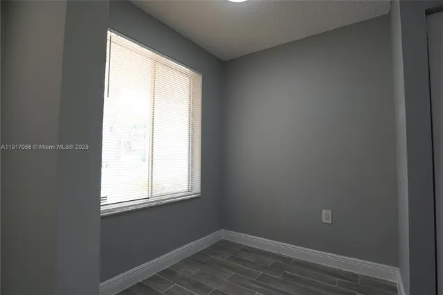 a view of a room that has a window in it