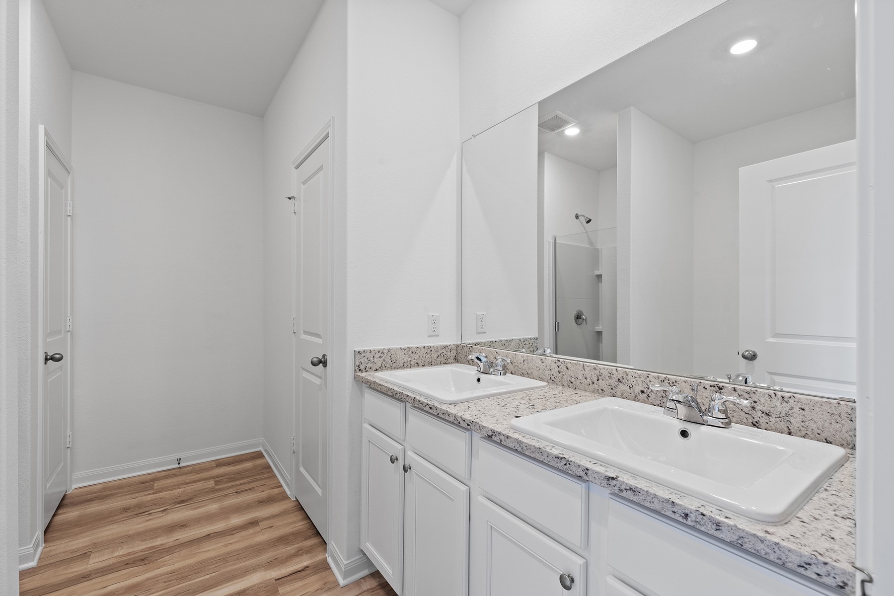 14617 Wahlbergs Way Elgin, TX 78621 - Photo 5 of 11 Inside the master bath, you’ll love the double-sink vanity, large soaker tub, separate shower and the huge walk-in closet