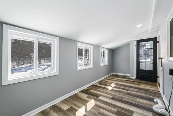 a bedroom with bed and a window
