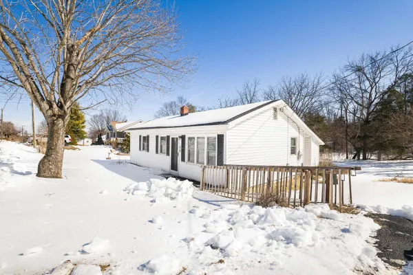 a view of a house with snow on the floor