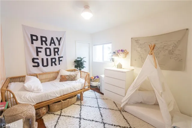 a living room with furniture and white walls