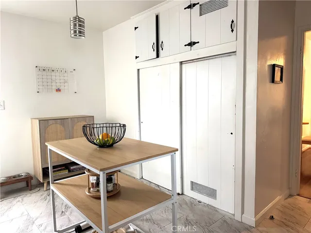 a view of kitchen with furniture and wooden floor