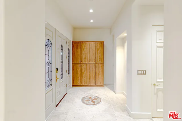 a view of a hallway with windows