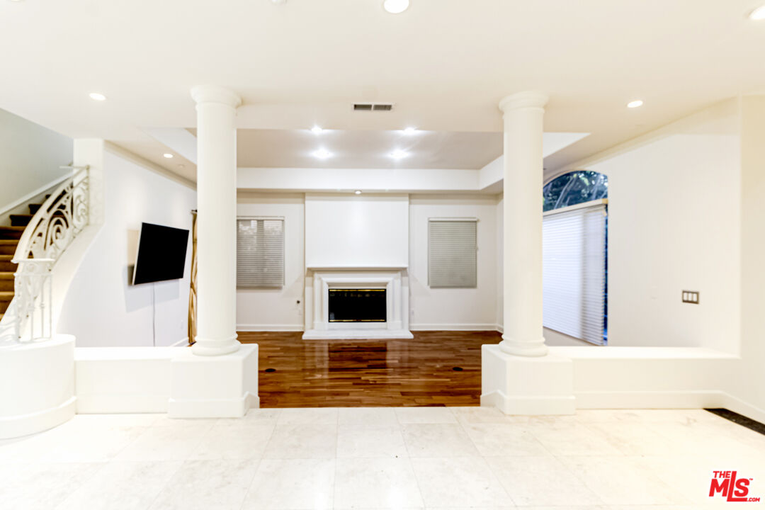 12626 Promontory Road Los Angeles, CA 90049 - Photo 5 of 34 a living room with furniture and a fireplace