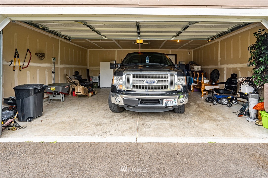 5120 180th Trail Southwest Rochester, WA 98579 - Photo 20 of 32 a view of garage with cars