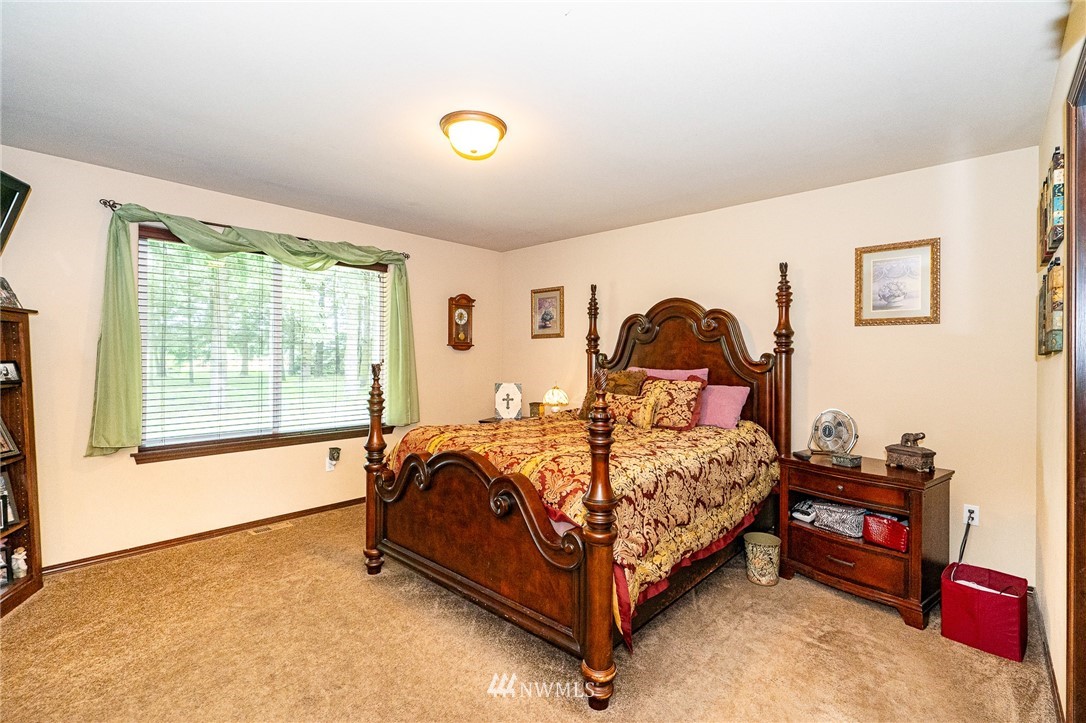 5120 180th Trail Southwest Rochester, WA 98579 - Photo 21 of 32 a bedroom with a bed and window