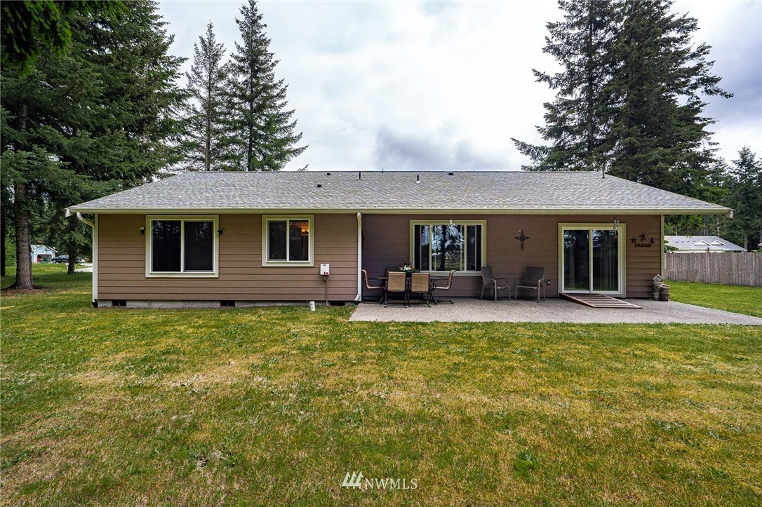 5120 180th Trail Southwest Rochester, WA 98579 - Photo 31 of 32 front view of a house with a yard