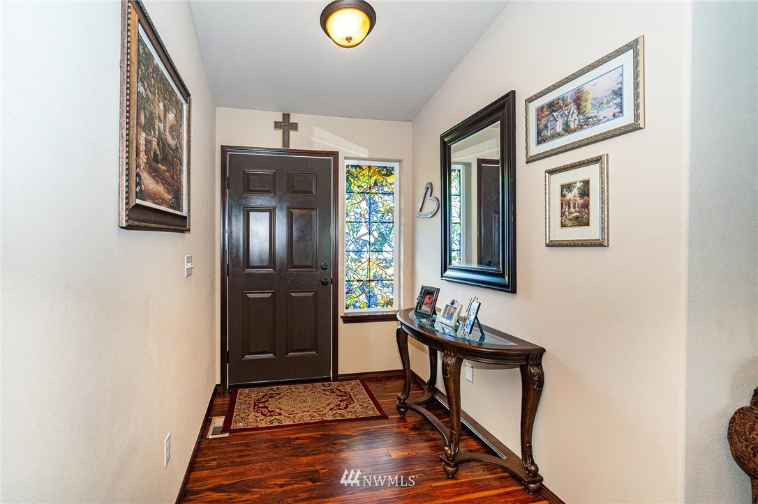 5120 180th Trail Southwest Rochester, WA 98579 - Photo 9 of 32 a view of an entryway with wooden floor