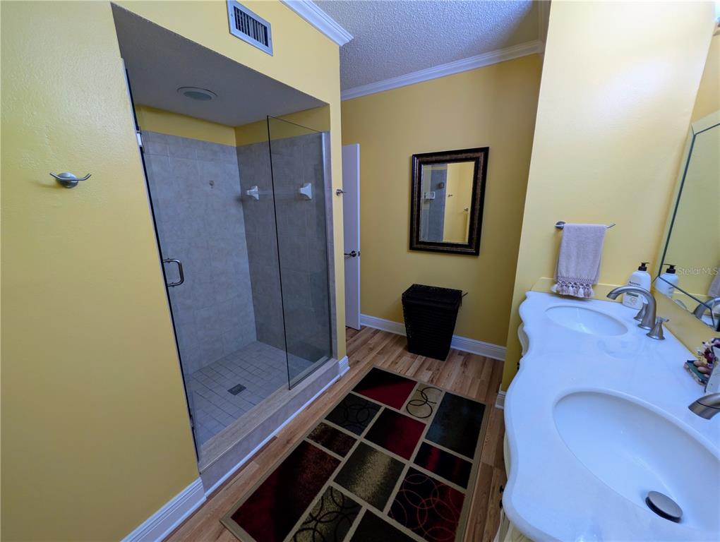 9897 Southwest 88th Court Road, Unit P Ocala, FL 34481 - Photo 22 of 35 a bathroom with a sink and a mirror