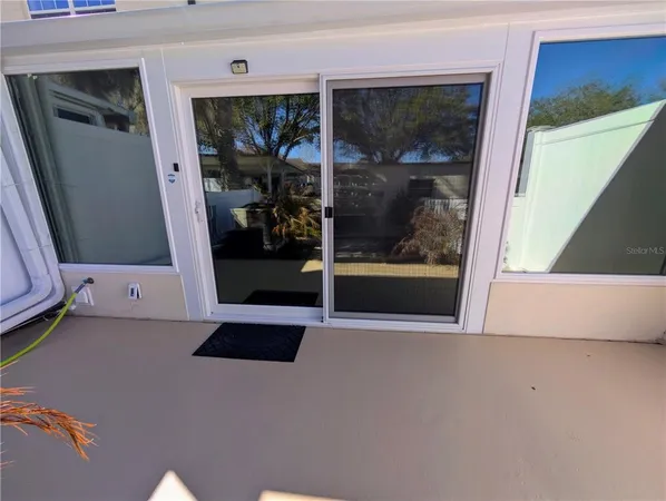 a view of a swimming pool with a garden
