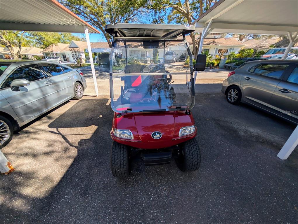 9897 Southwest 88th Court Road, Unit P Ocala, FL 34481 - Photo 31 of 35 a view of a cars park in front of a building
