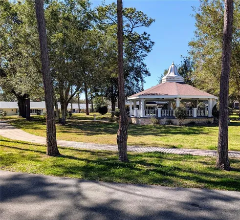 a view of a cars park in front of a house