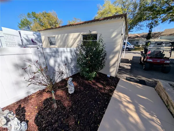 a view of a backyard with plants