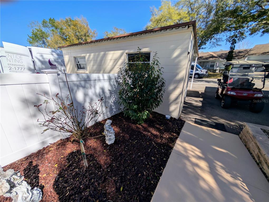 9897 Southwest 88th Court Road, Unit P Ocala, FL 34481 - Photo 34 of 35 a view of a cars park in front of a house