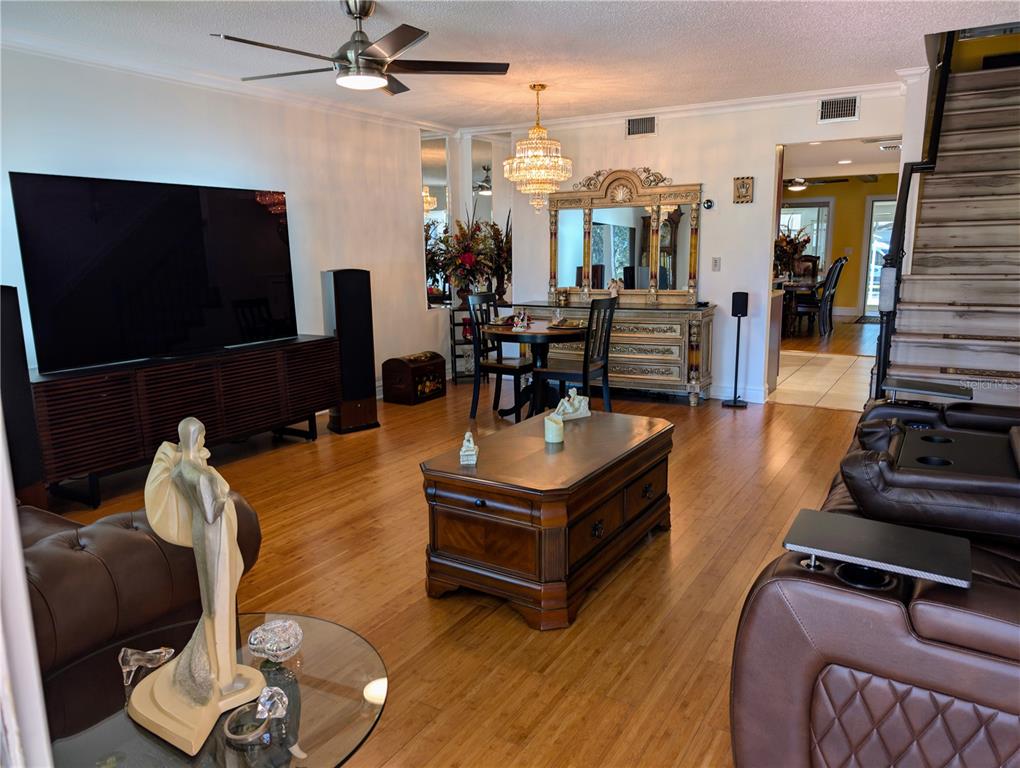 9897 Southwest 88th Court Road, Unit P Ocala, FL 34481 - Photo 8 of 35 a living room with furniture and a flat screen tv
