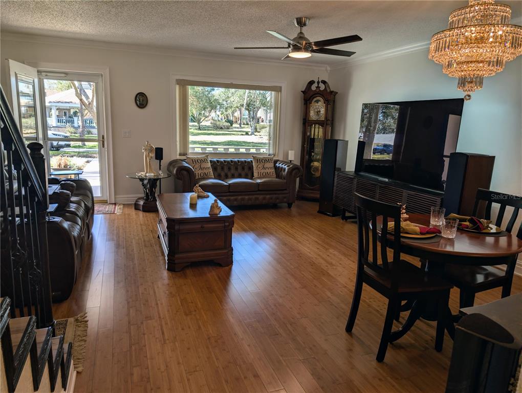 9897 Southwest 88th Court Road, Unit P Ocala, FL 34481 - Photo 10 of 35 a living room with furniture and a flat screen tv
