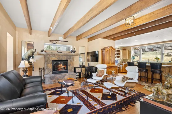 a bathroom with a sink toilet vanity and shower