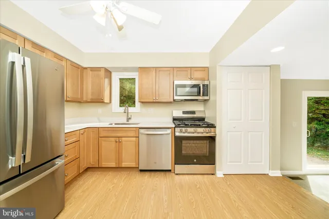 a view of an empty room with a fireplace