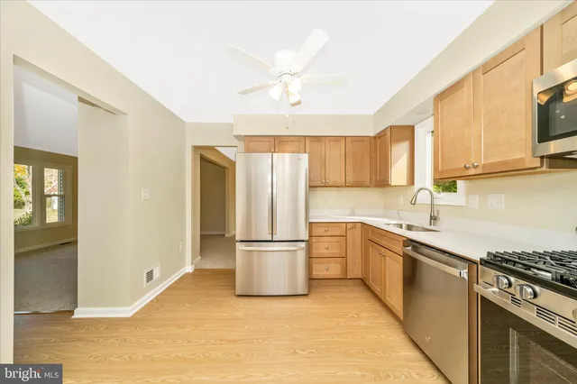 a view of an empty room with a fireplace