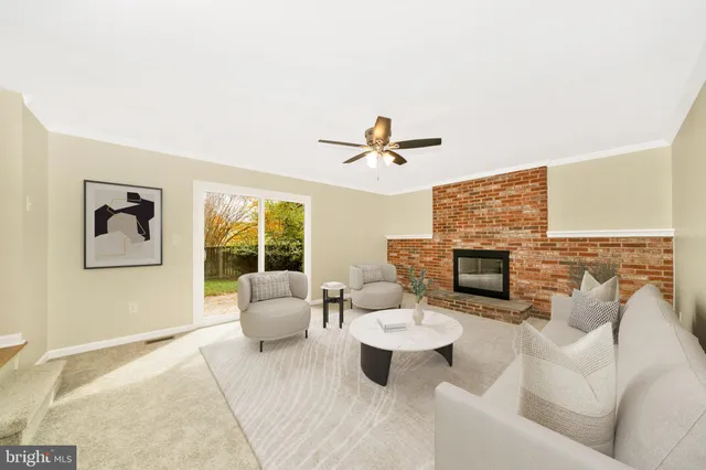 a living room with furniture and fireplace