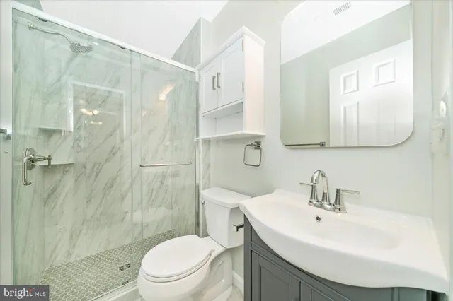 a view of a room with a window and closet