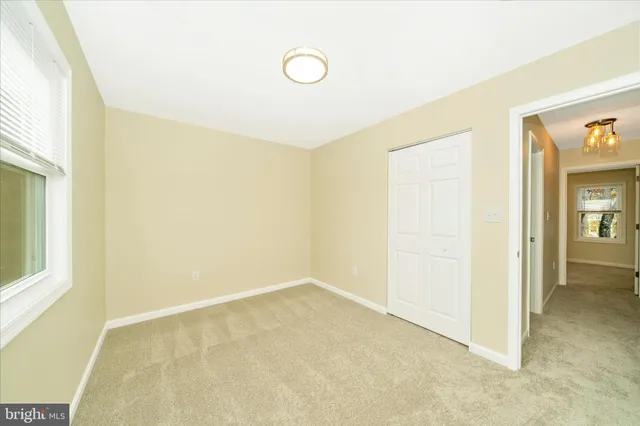 a view of a kitchen from the hallway
