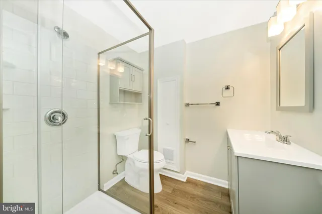 a view of a park with iron fence